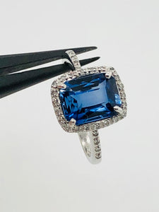 9k white gold ring with blue stone