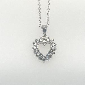 silver claw set cz heart pendant; 1.9 grams; chain not included