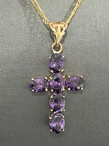9k yellow gold cross with calibrated 6 oval amethysts