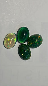 2.70cts green opal parcel; 4 stones; sizes are 8.1x5.8x2.9mm, 8x6.3x3.6mm, 8x5.95x3.3m, 7.7x5.75x2.05mm