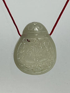 jade bottle with red cord