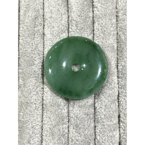 natural jade donut (Pi-Disc), 16.38g; 39mm in diameter; the item resembles the ancient coin