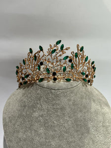 yellow metal tiara with green and white rhinestones in twig decor