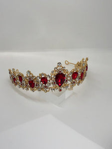 tiara in yellow metal with vivid red rhinestones