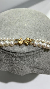 Freshwater pearl double row necklace with 14k gold clasp; around 17 inches the longer strand