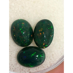2.25cts black opal parcel; 3 stones; sizes are 8.1x5.8x2.9mm, 8x6.3x3.6mm, 8x5.95x3.3mm