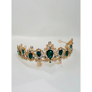 tiara in yellow metal with vivid green rhinestones