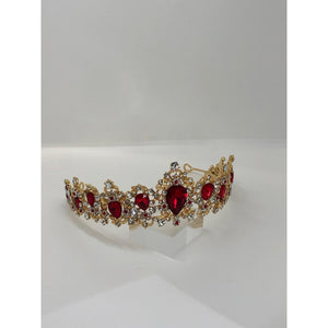tiara in yellow metal with vivid red rhinestones