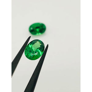 tsavorites, the matching pair, oval cuts; 1.355cts; 6.5x4.75x3.1mm and 6.5x4.7x3.3mm