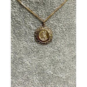 9k yellow gold St Christopher pendant; 0.62g; width 16mm, height with bail 21mm; chain not included