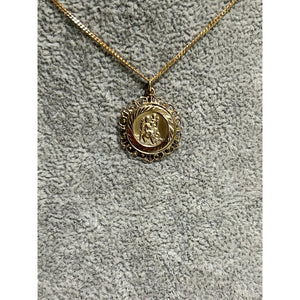 9k yellow gold St Christopher pendant; 0.62g; width 16mm, height with bail 21mm; chain not included